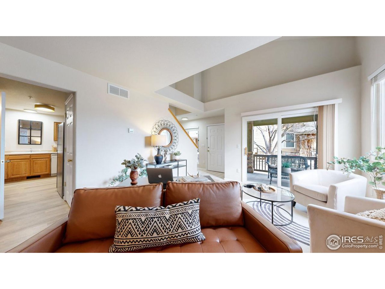 2621 Rigden Parkway, Unit 4 Fort Collins, CO 80525 - Photo 7 of 28 a living room with furniture and a large window