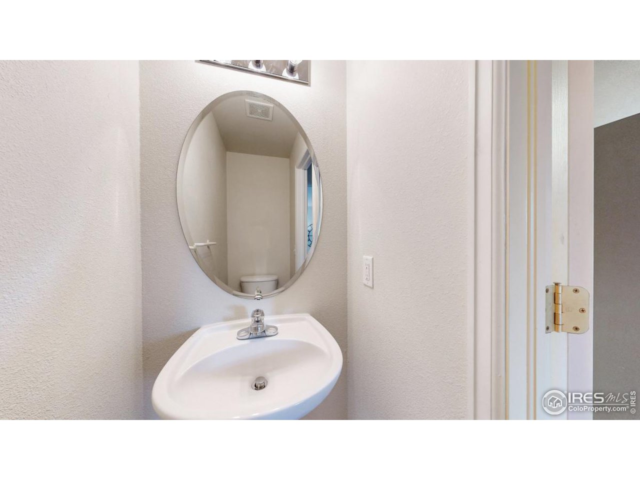 2621 Rigden Parkway, Unit 4 Fort Collins, CO 80525 - Photo 8 of 28 a bathroom with a sink and a mirror