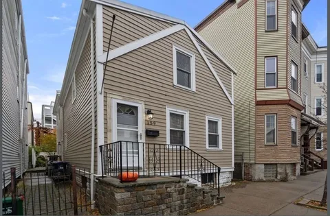 a front view of a house with a garage