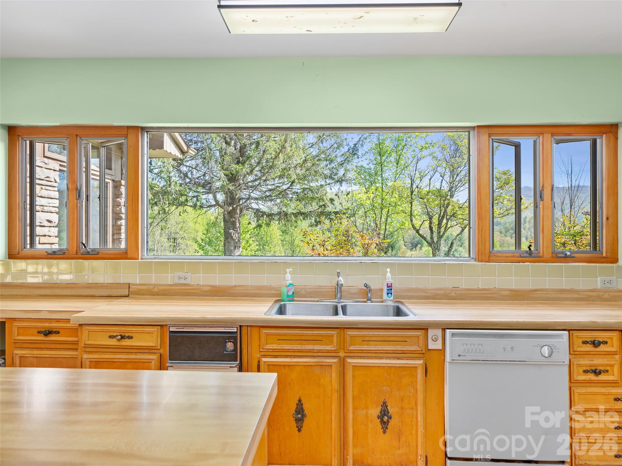 110 Crest View Road Burnsville, NC 28714 - Photo 13 of 45 a view of kitchen and wooden floor