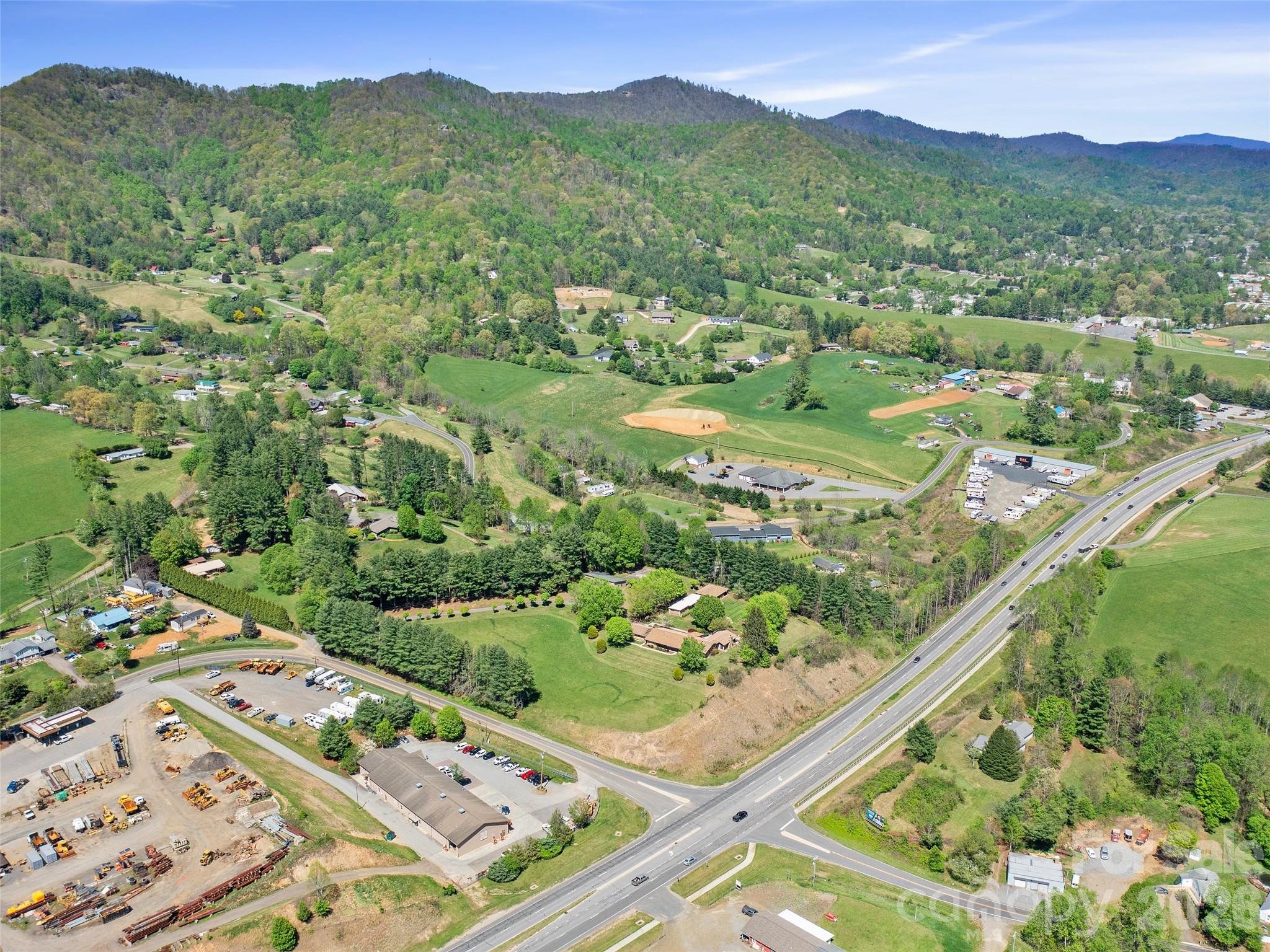 110 Crest View Road Burnsville, NC 28714 - Photo 2 of 45 a view of a city with lush green forest