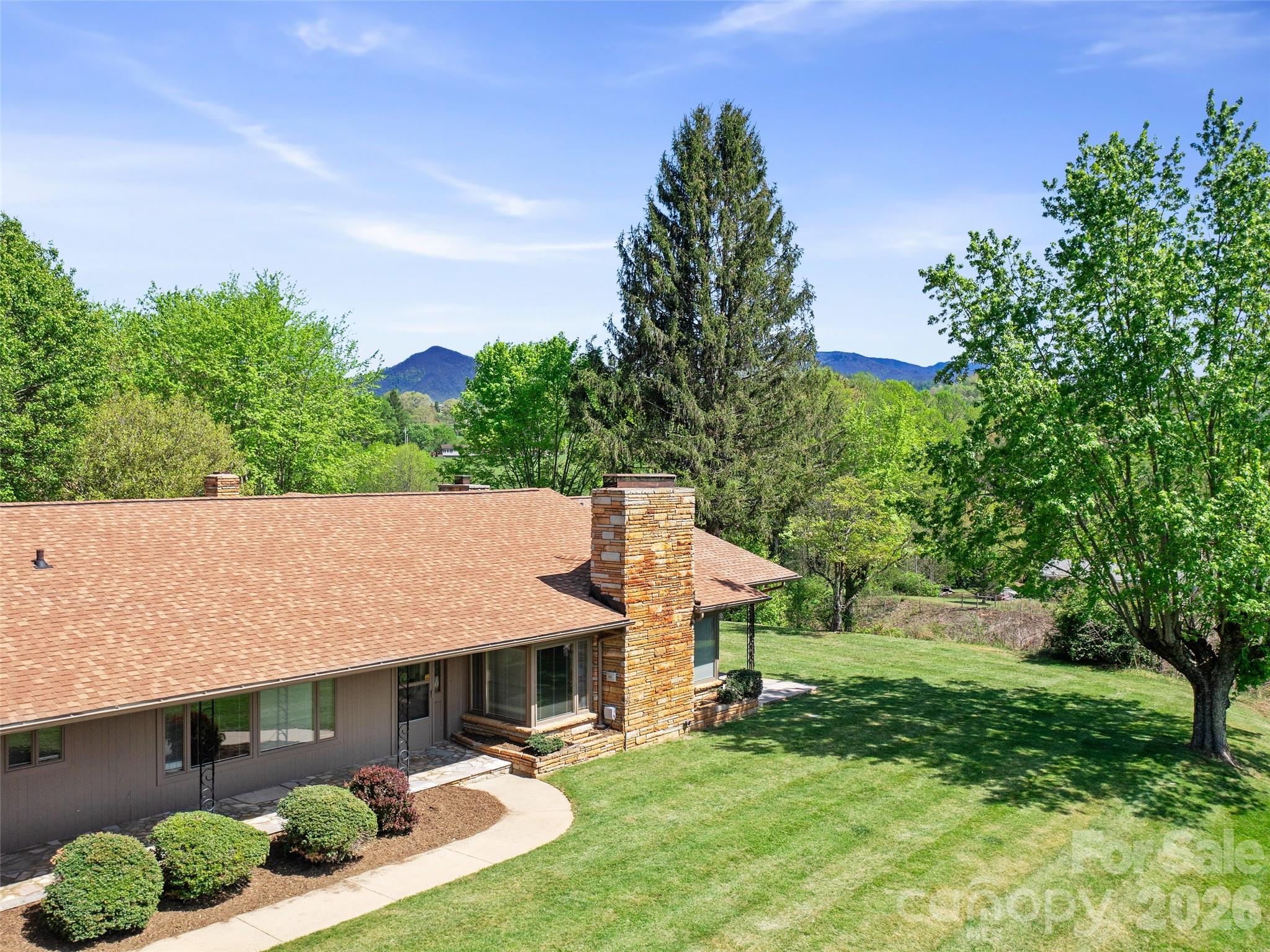 110 Crest View Road Burnsville, NC 28714 - Photo 24 of 45 an aerial view of a house with swimming pool and garden