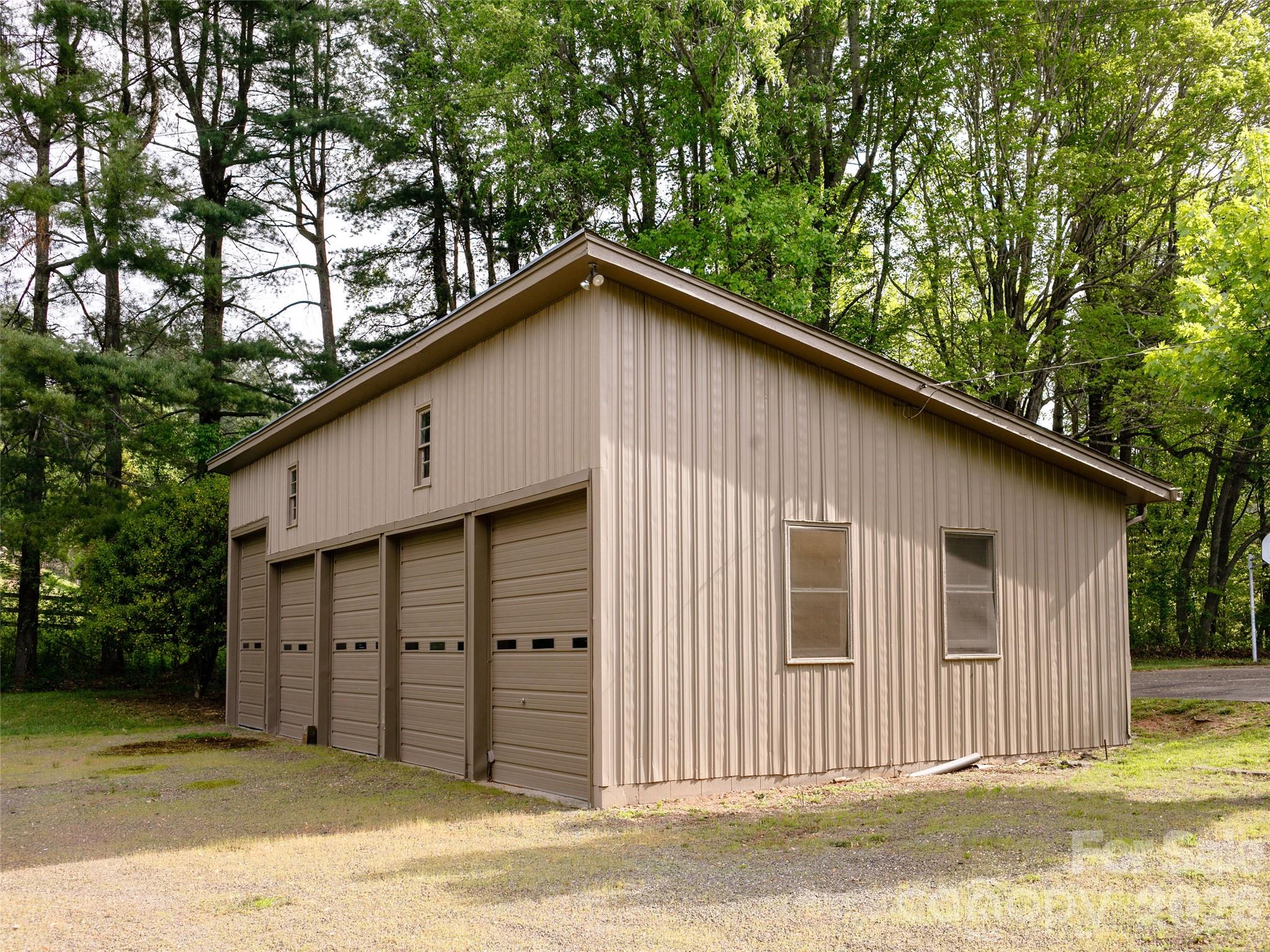 110 Crest View Road Burnsville, NC 28714 - Photo 28 of 45 a view of a house with a backyard