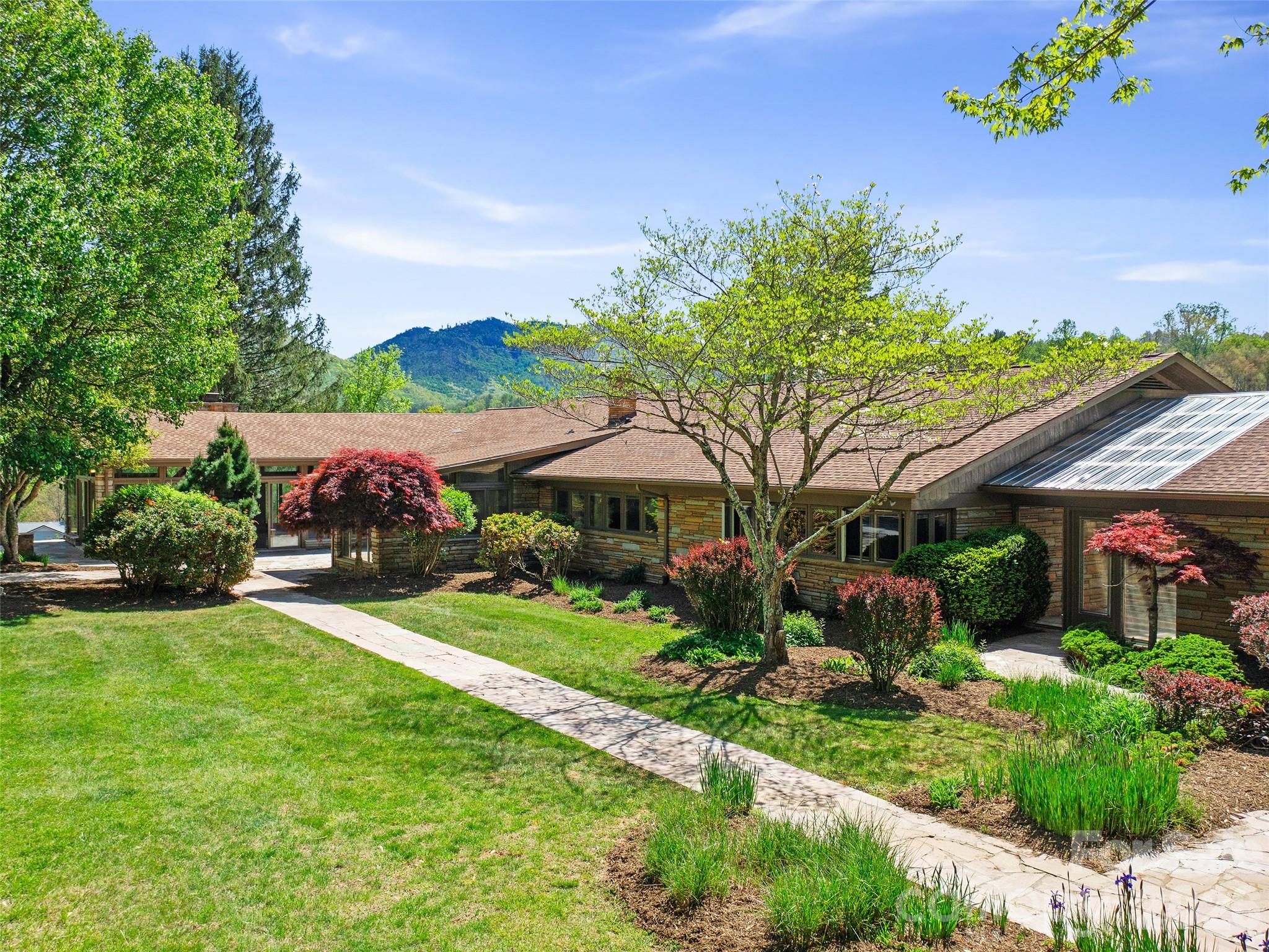 110 Crest View Road Burnsville, NC 28714 - Photo 4 of 45 a view of a house with a garden