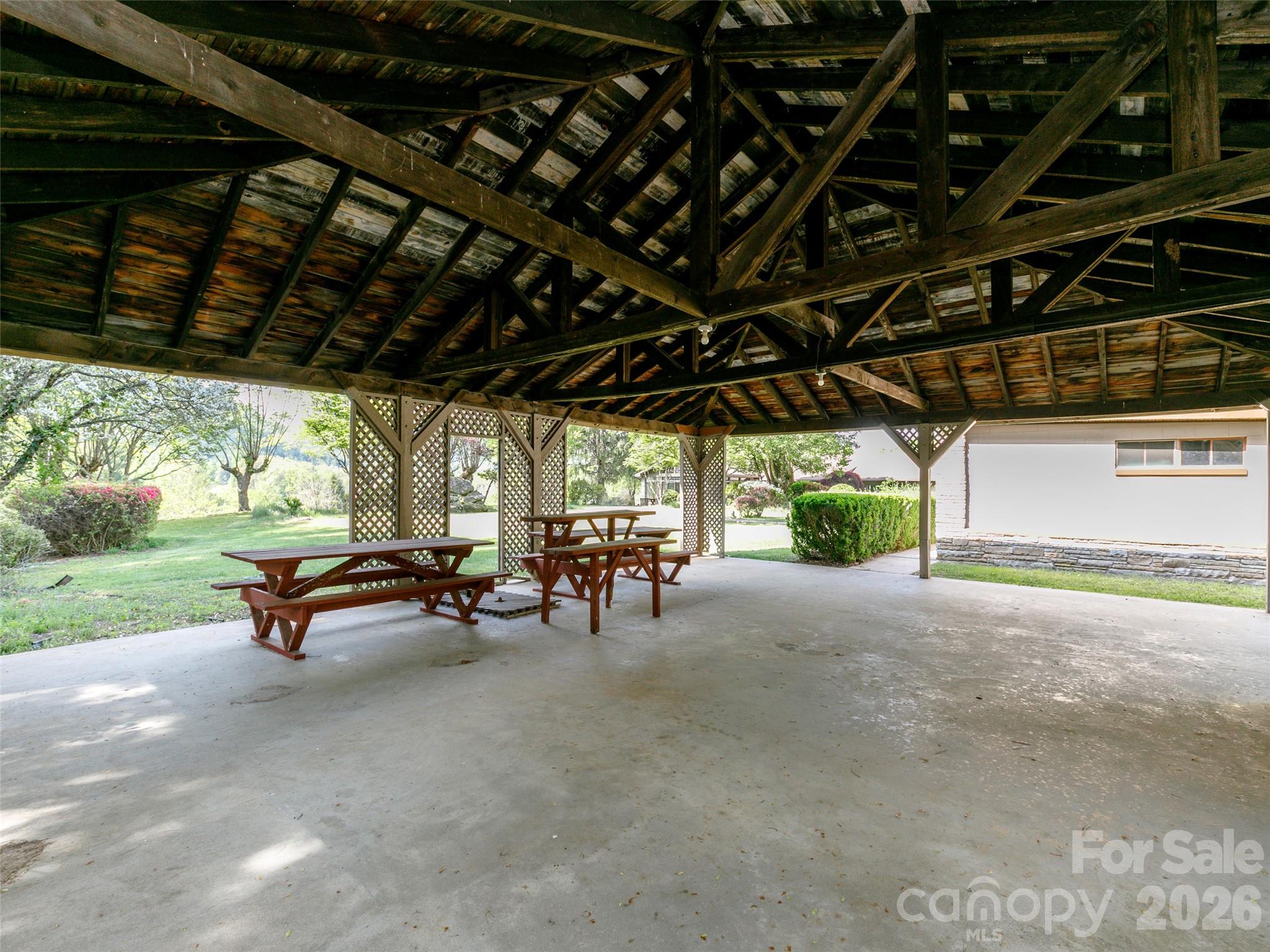 110 Crest View Road Burnsville, NC 28714 - Photo 41 of 45 a view of a porch with furniture and a backyard