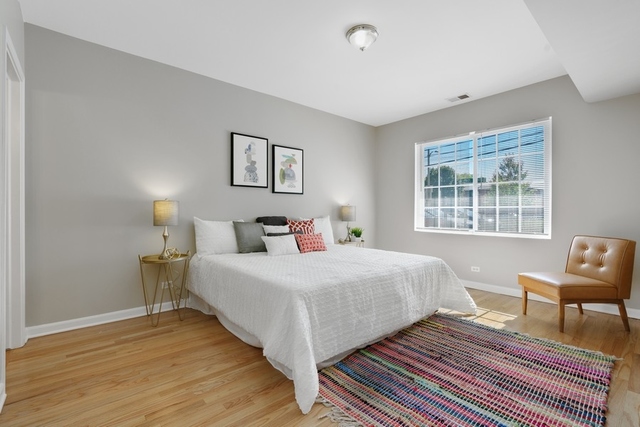 2349 West Harrison Street, Unit 1 Chicago, IL 60612 - Photo 12 of 25 a bedroom with double bed and a window