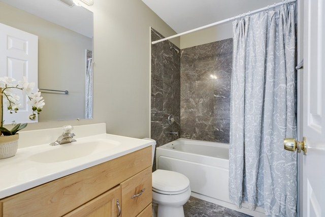 2349 West Harrison Street, Unit 1 Chicago, IL 60612 - Photo 14 of 25 a bathroom with a sink toilet and shower