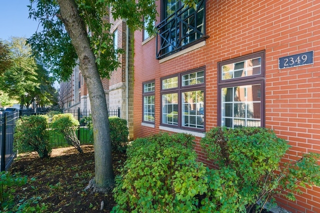 2349 West Harrison Street, Unit 1 Chicago, IL 60612 - Photo 22 of 25 a view of a building with garden and plants
