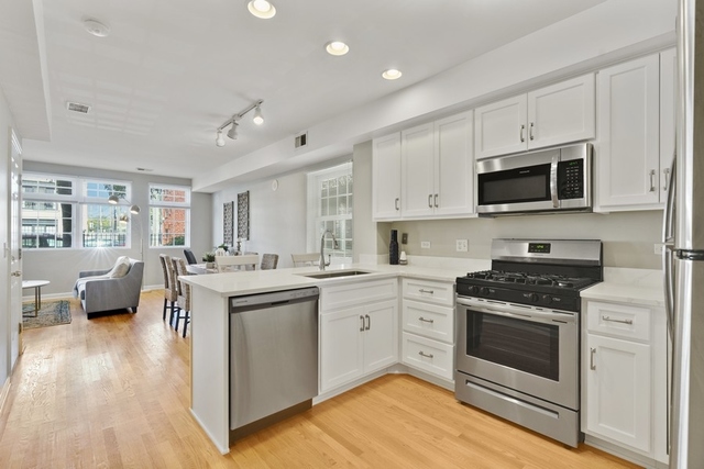 2349 West Harrison Street, Unit 1 Chicago, IL 60612 - Photo 8 of 25 a kitchen with a stove a sink and a microwave