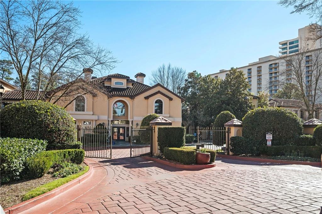 3777 Peachtree Road Northeast, Unit 914 Atlanta, GA 30319 - Photo 1 of 1 a front view of a house with a yard