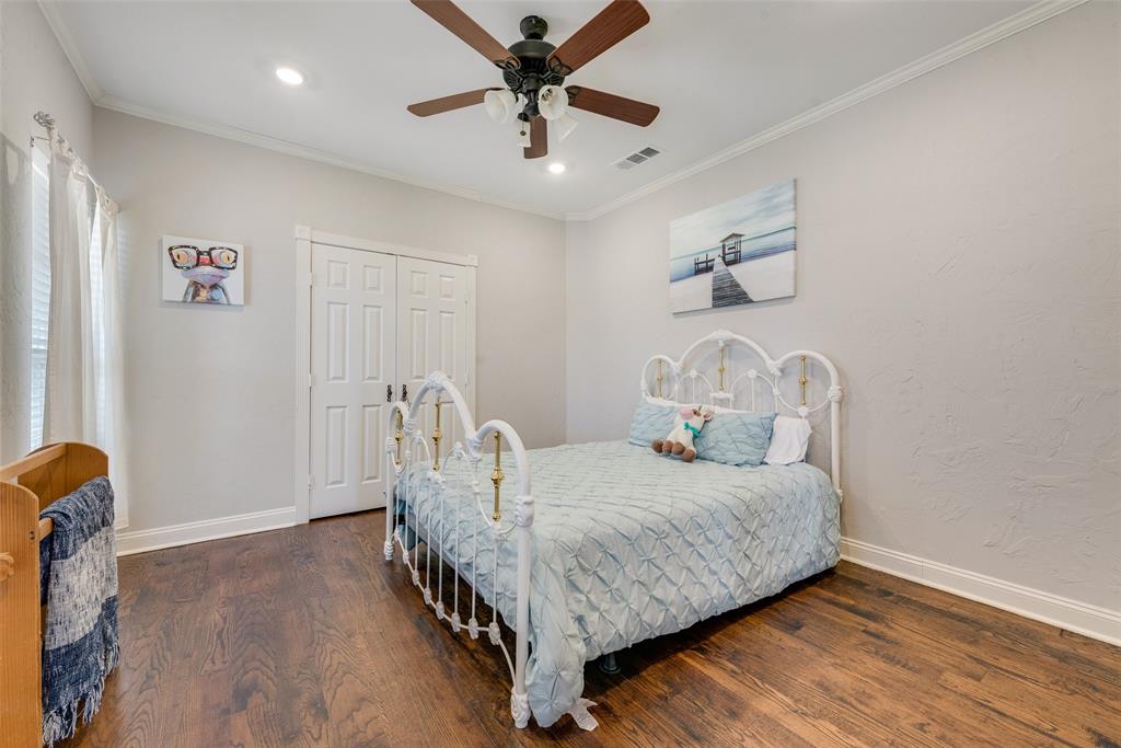 669 VZ County Road Canton, TX 75103 - Photo 26 of 40 a bedroom with a bed and a chandelier