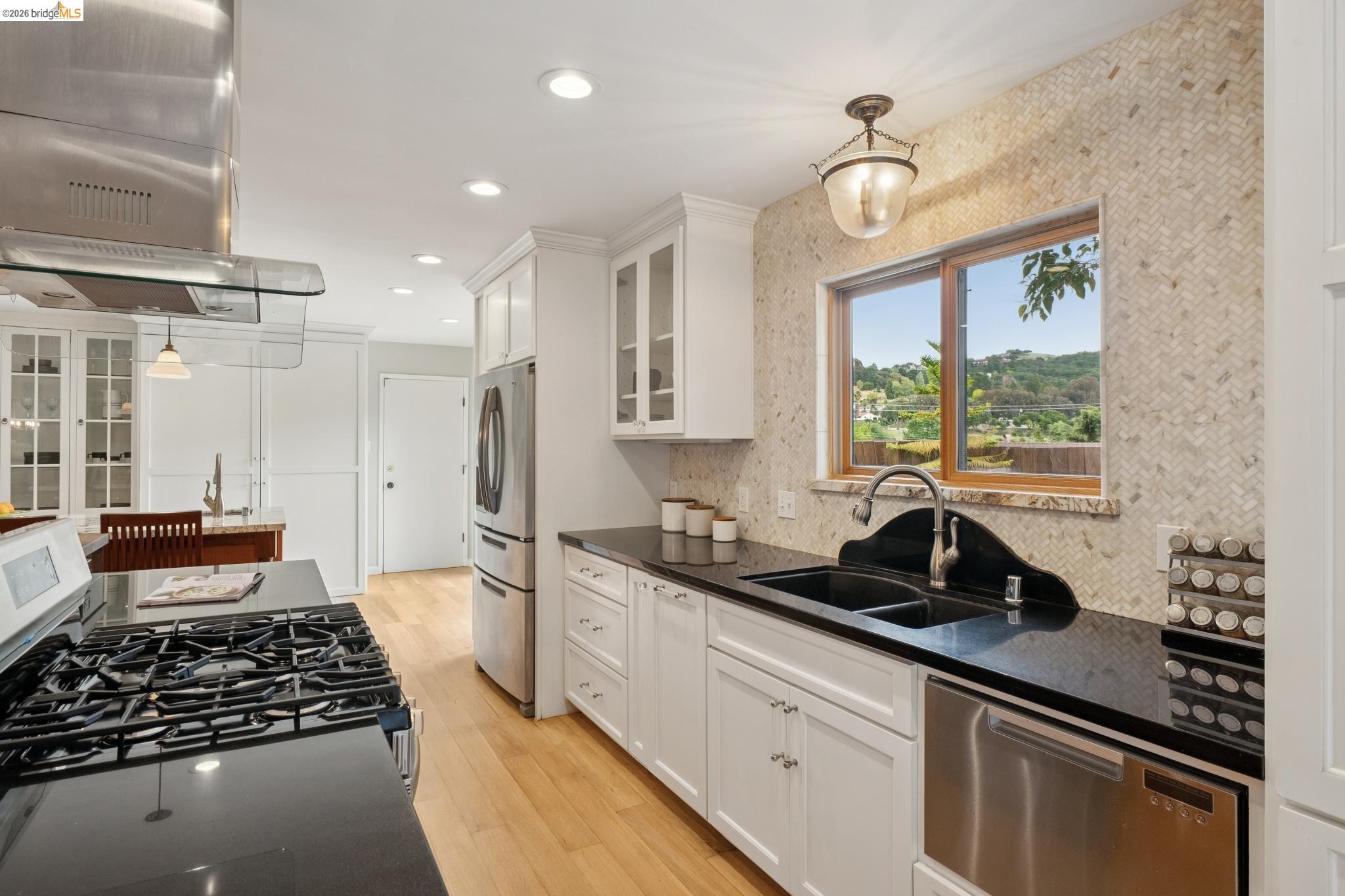 15 Christopher Court El Sobrante, CA 94803 - Photo 24 of 99 a kitchen with stainless steel appliances a sink stove and cabinets