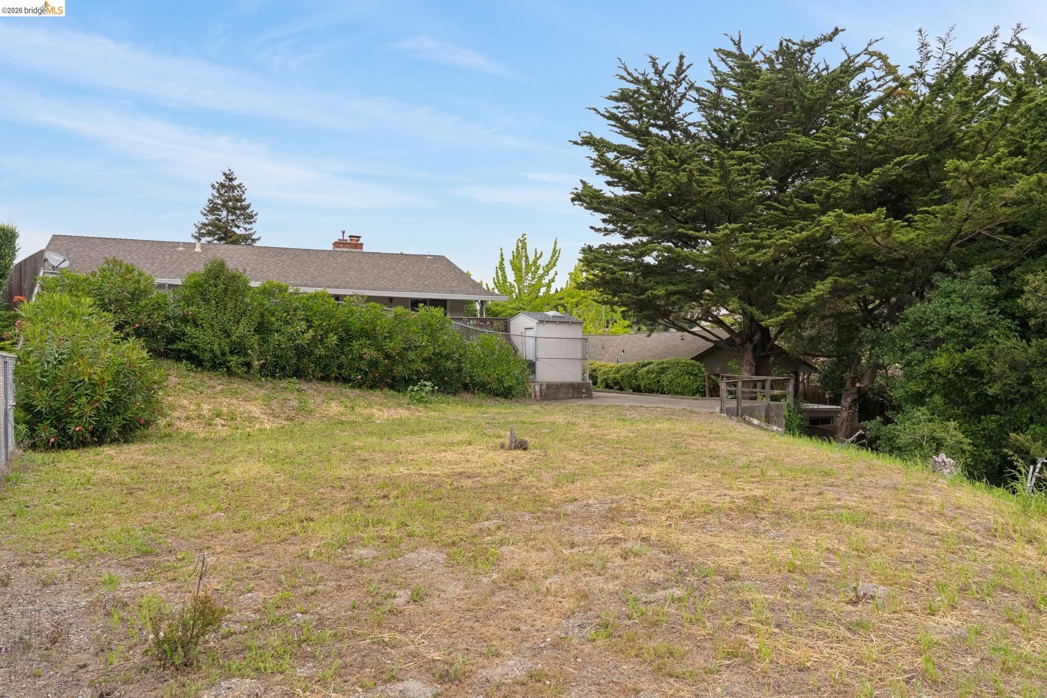 15 Christopher Court El Sobrante, CA 94803 - Photo 98 of 99 a front view of a house with a yard and garage