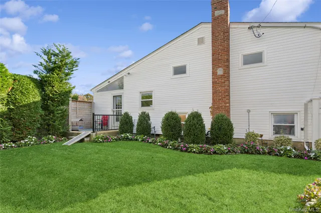 a balcony with furniture and a window