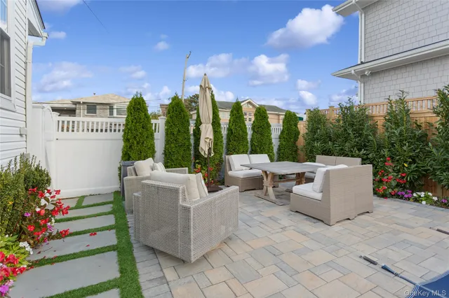 a view of a patio with couches and potted plants