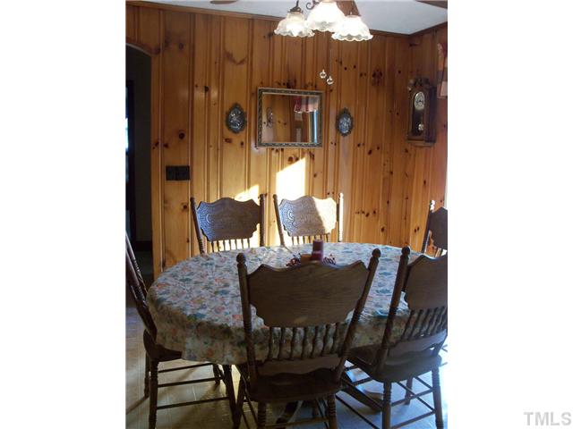 222 Thaxton Road Roxboro, NC 27573 - Photo 8 of 19 Dining area with knotty pine paneling, has that cozy feeling.