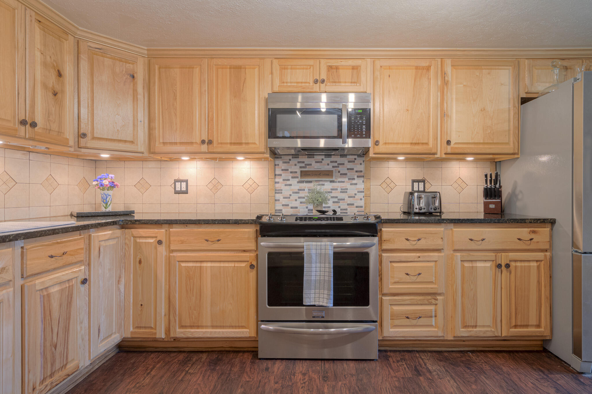 5484 Lead Mine Road Hiwassee, VA 24347 - Photo 21 of 86 a kitchen with stainless steel appliances granite countertop a refrigerator and cabinets