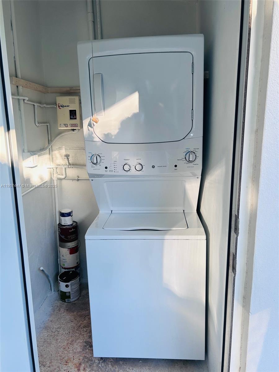 7311 Southwest 63rd Court, Unit 1 South Miami, FL 33143 - Photo 13 of 14 a close view of water heater washer and dryer