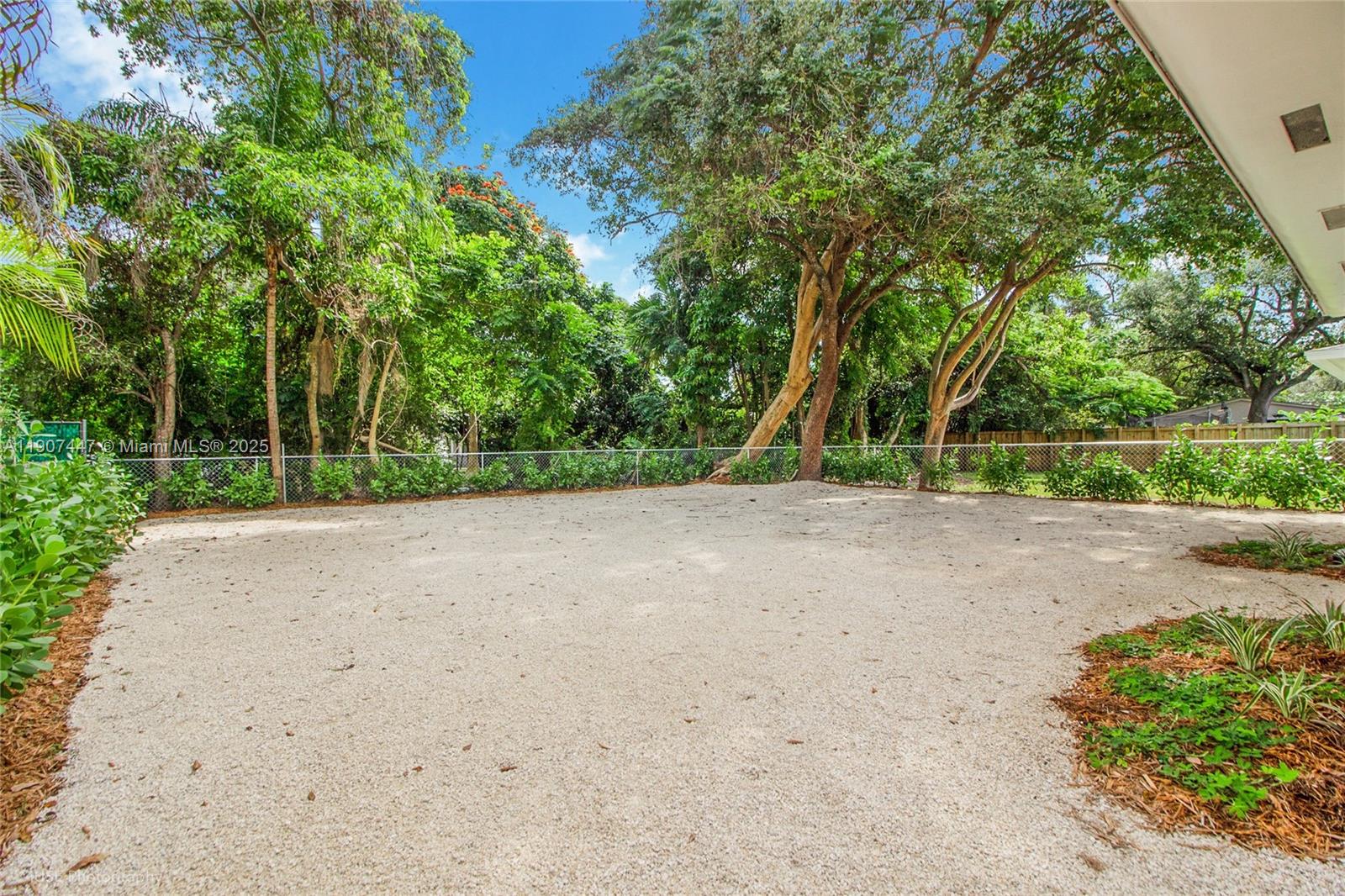 7311 Southwest 63rd Court, Unit 1 South Miami, FL 33143 - Photo 4 of 14 a view of a field with trees in the background