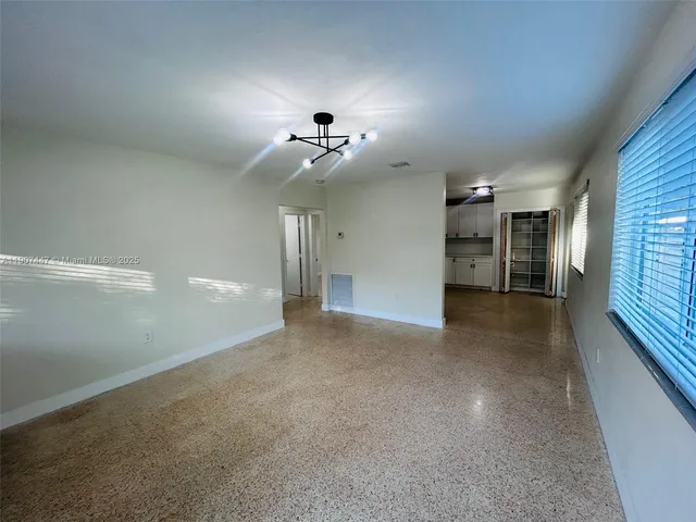 a view of a hallway with a chandelier