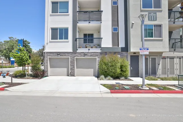 a terrace with outdoor seating and city view