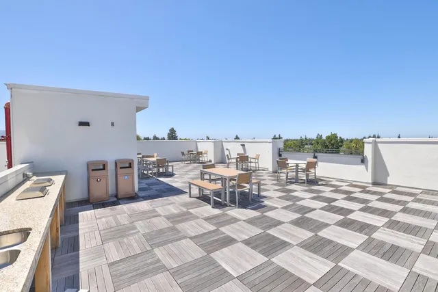 an aerial view of a house with a mountain view