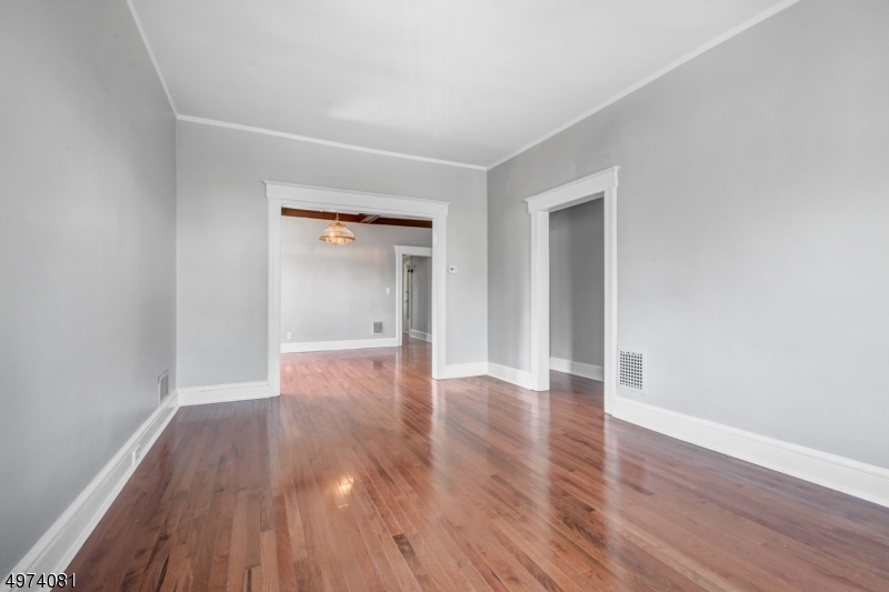558 Summit Avenue, Unit 1 Westfield, NJ 07090 - Photo 12 of 13 a view of an empty room and wooden floor
