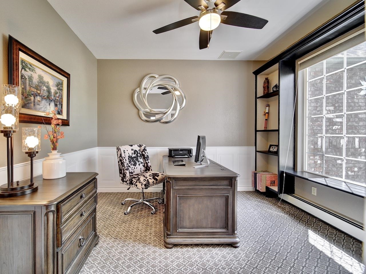 2332 North Falcon Point Court Grand Junction, CO 81507 - Photo 14 of 39 a living room with furniture a chandelier and a flat screen tv
