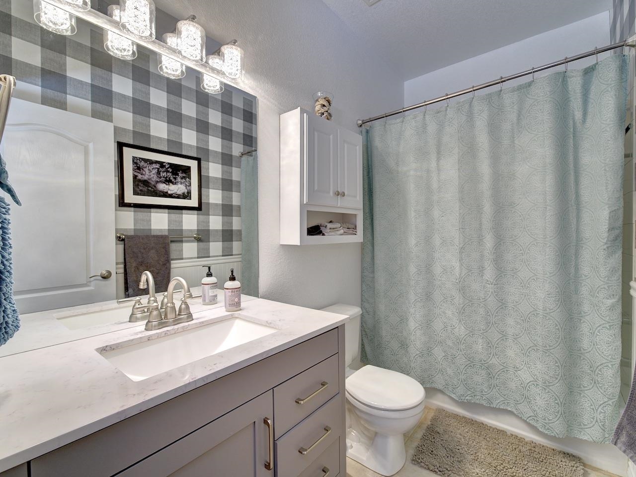 2332 North Falcon Point Court Grand Junction, CO 81507 - Photo 20 of 39 a bathroom with a sink a toilet and a mirror