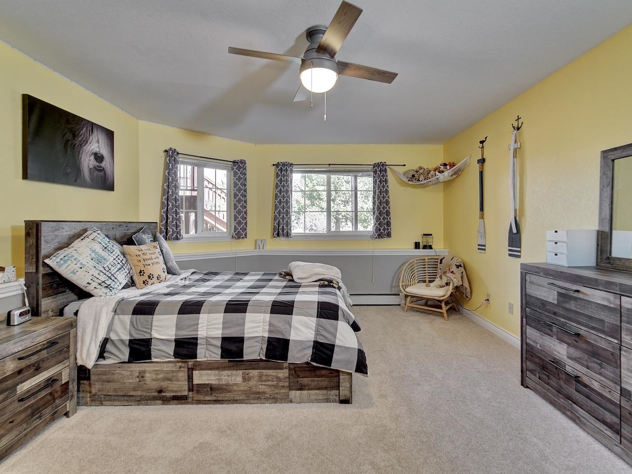 2332 North Falcon Point Court Grand Junction, CO 81507 - Photo 23 of 39 a spacious bedroom with a bed and ceiling fan