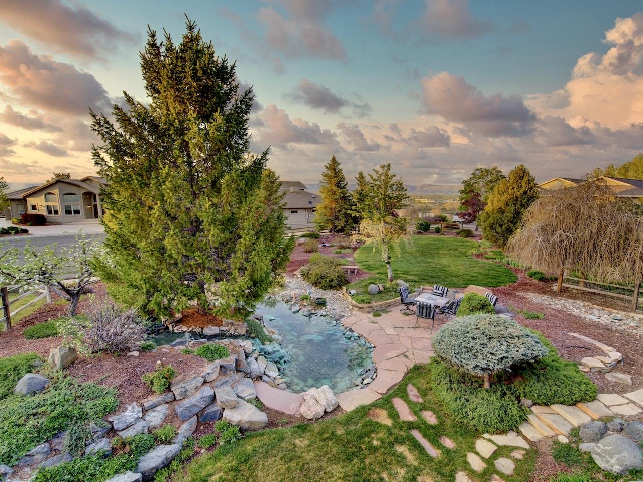 2332 North Falcon Point Court Grand Junction, CO 81507 - Photo 28 of 39 a view of a garden with flowers