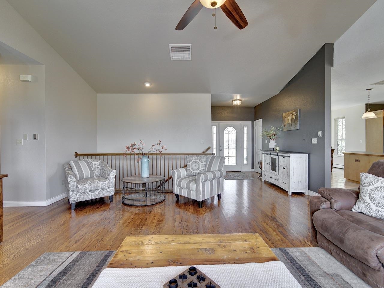 2332 North Falcon Point Court Grand Junction, CO 81507 - Photo 5 of 39 a living room with furniture and wooden floor