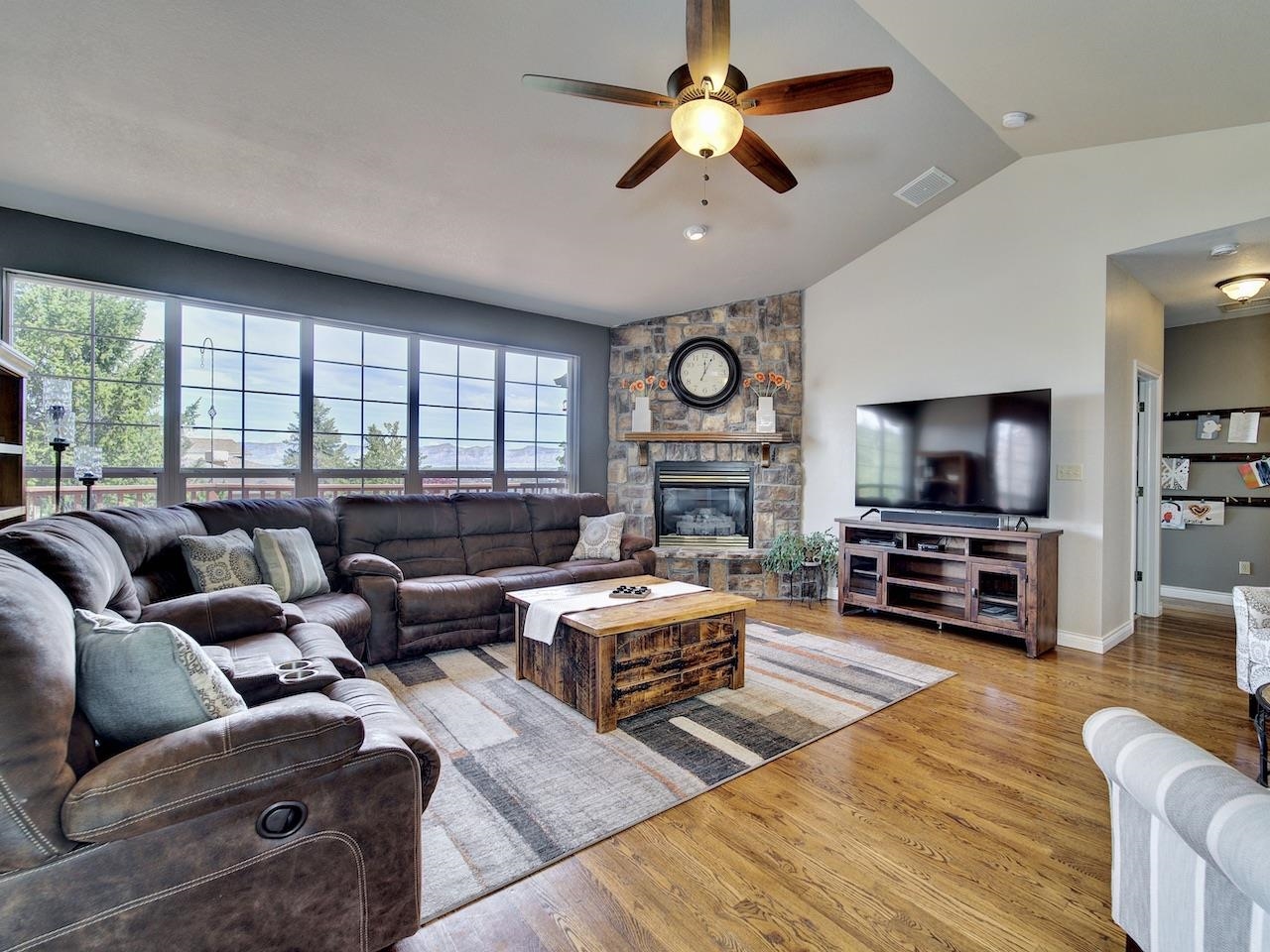 2332 North Falcon Point Court Grand Junction, CO 81507 - Photo 6 of 39 a living room with furniture and a flat screen tv