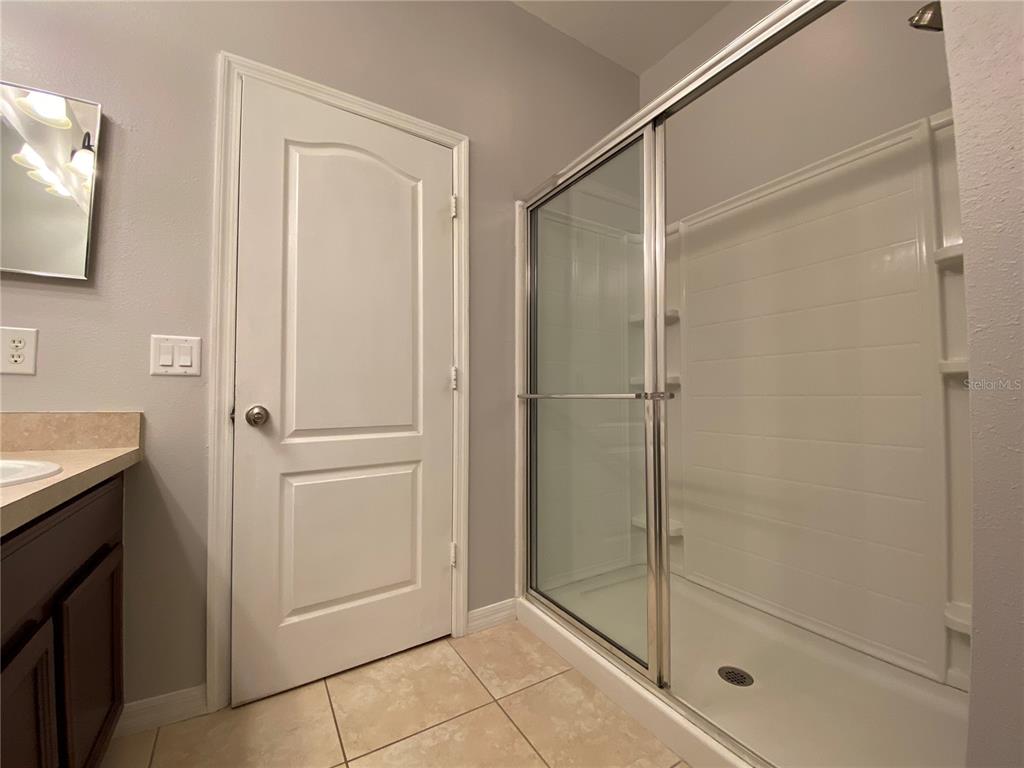 6460 South Goldenrod Road, Unit 30B Orlando, FL 32822 - Photo 12 of 20 a bathroom with a shower and a sink