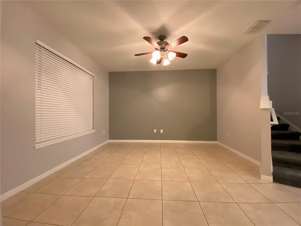 6460 South Goldenrod Road, Unit 30B Orlando, FL 32822 - Photo 3 of 20 a view of an empty room with a window