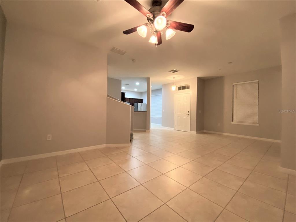 6460 South Goldenrod Road, Unit 30B Orlando, FL 32822 - Photo 5 of 20 a view of a livingroom with a ceiling fan and window