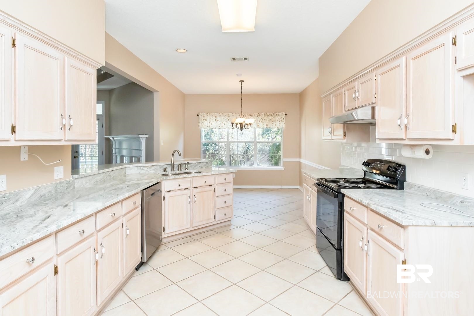 6117 Lennox Place Mobile, AL 36693 - Photo 4 of 39 Kitchen with stainless steel dishwasher, black electric range oven, a sink, a peninsula, and under cabinet range hood