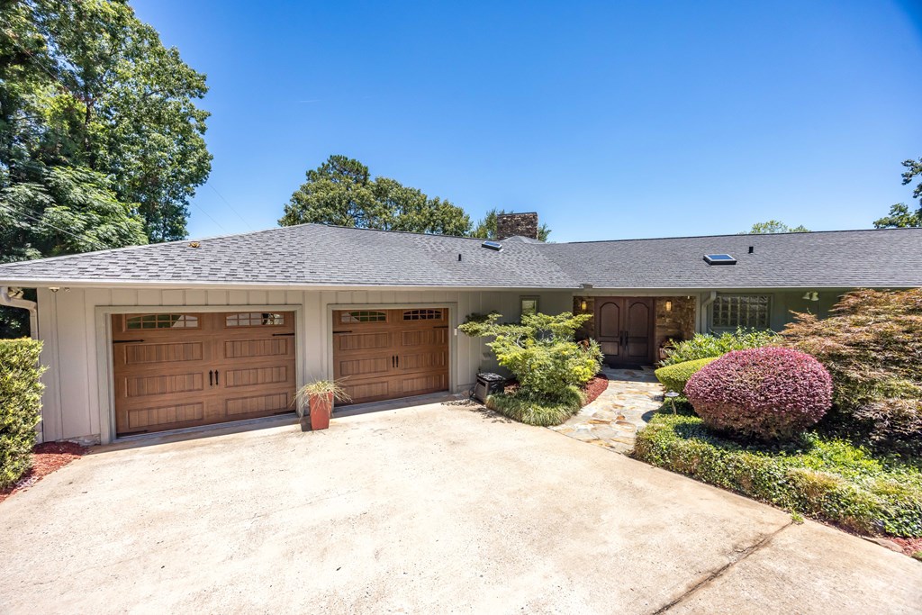 5 Odom Drive Hamilton, GA 31811 - Photo 10 of 89 a front view of a house with a yard and garage
