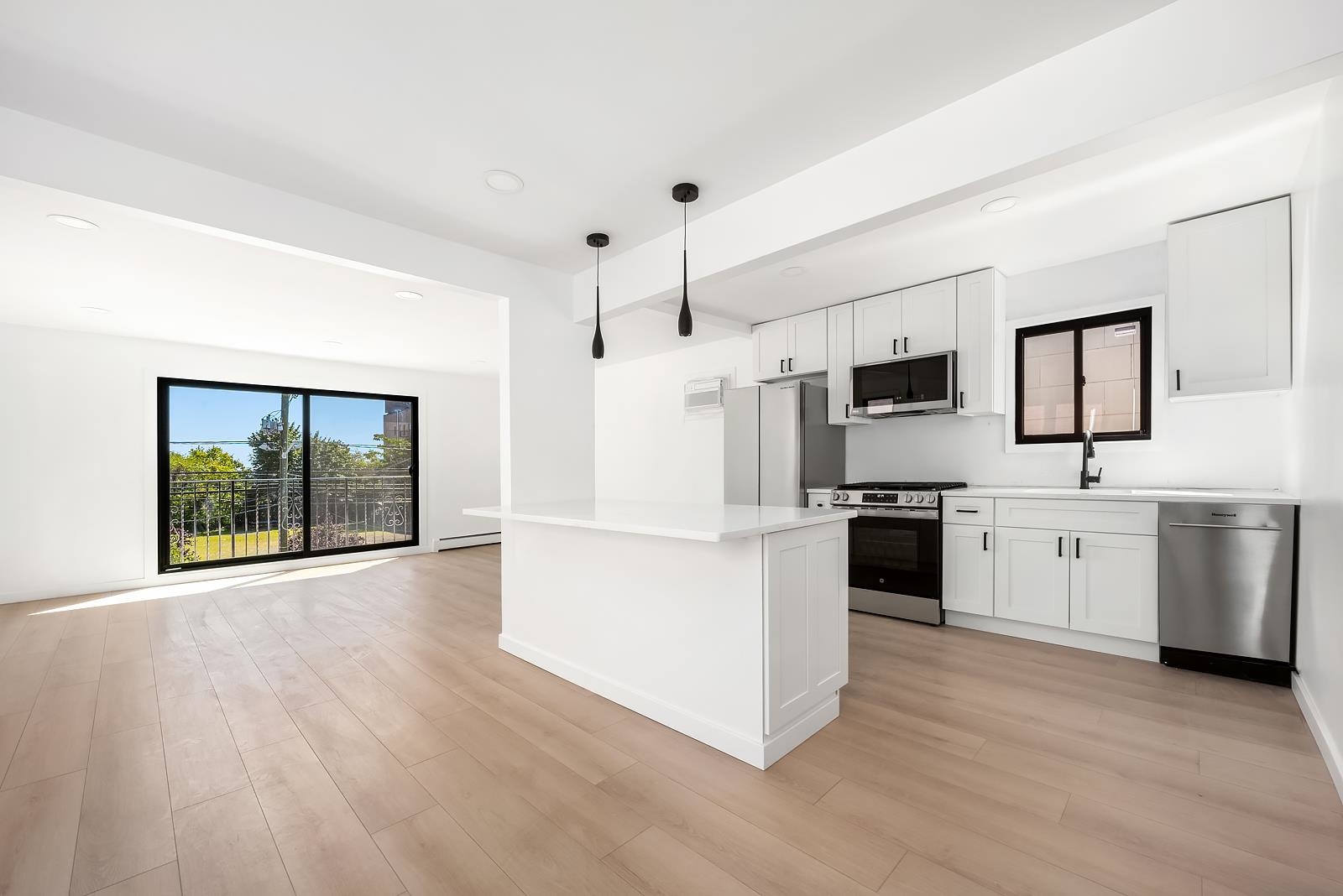 a kitchen with stainless steel appliances a refrigerator and a stove top oven