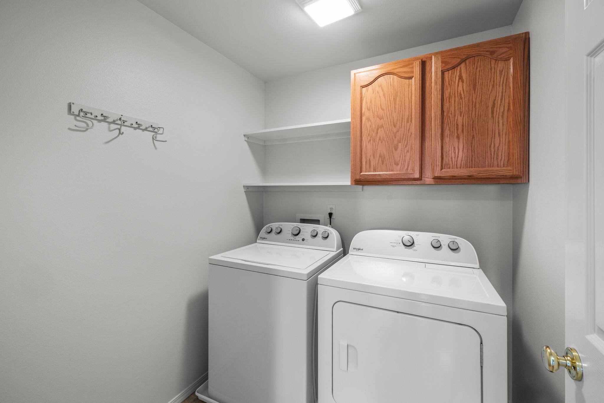 348 Northwest Antler Loop Redmond, OR 97756 - Photo 20 of 34 laundry room off hallway near primary suite