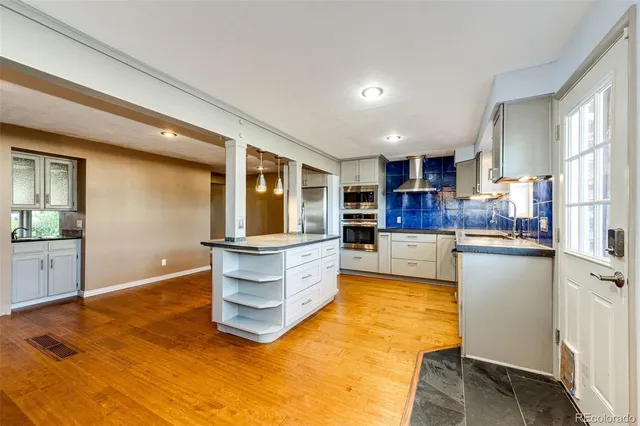 a kitchen with kitchen island cabinets and counter space