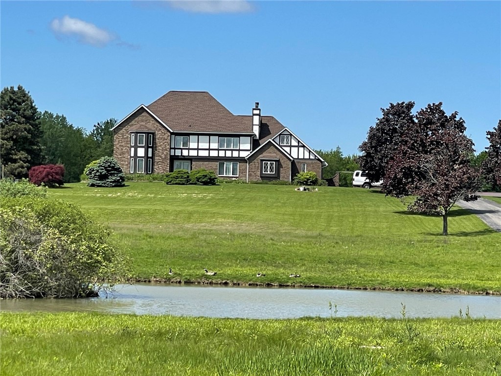817 Whittier Road Ogden, NY 14559 - Photo 2 of 48 Front of house with pond