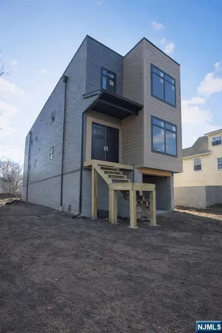 a view of a kitchen with stainless steel appliances