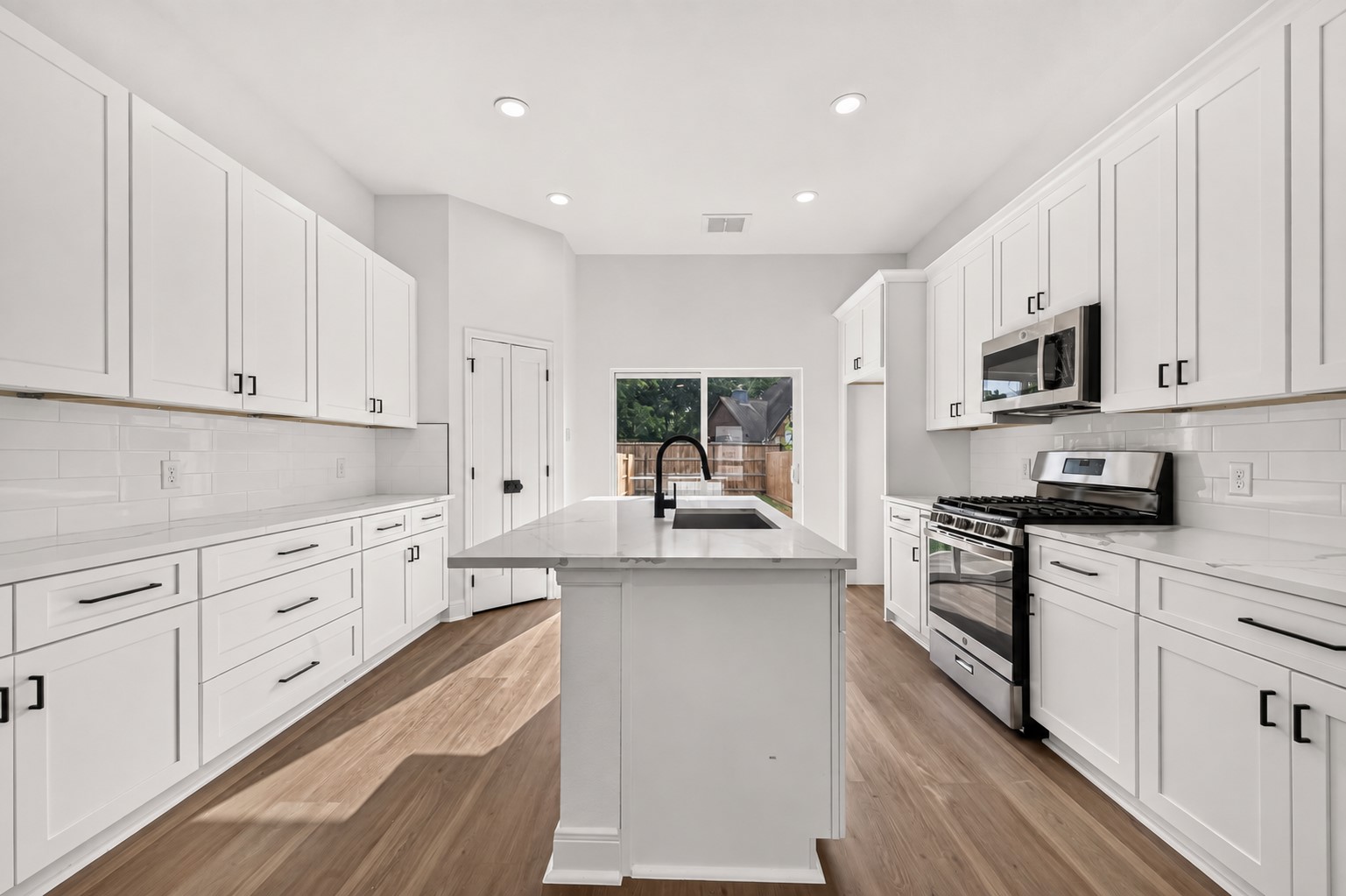 8110 Carver Road Houston, TX 77088 - Photo 6 of 38 Plenty of cabinetry provides the storage you want without sacrificing the clean, modern feel of the kitchen.
