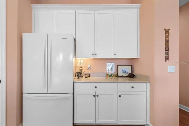 a living room with furniture large window and a flat screen tv