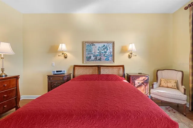 a bedroom with a bed and a dresser