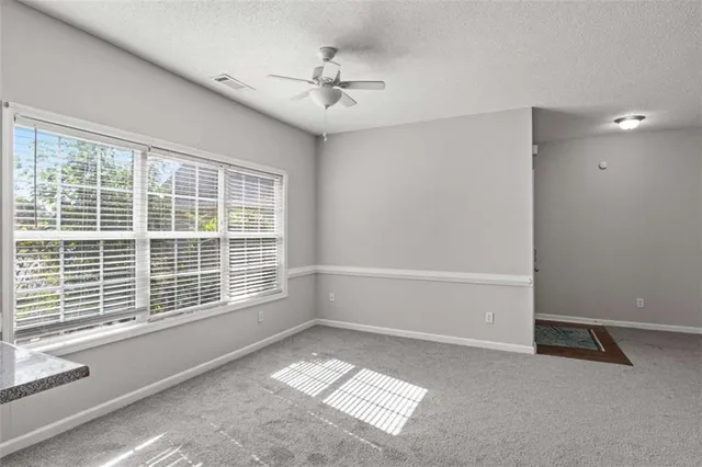 a kitchen with a refrigerator a stove a sink dishwasher and wooden cabinets with wooden floor