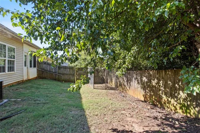 a backyard of a house with lots of green space