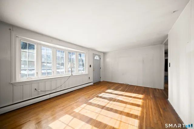 a view of an empty room with a window