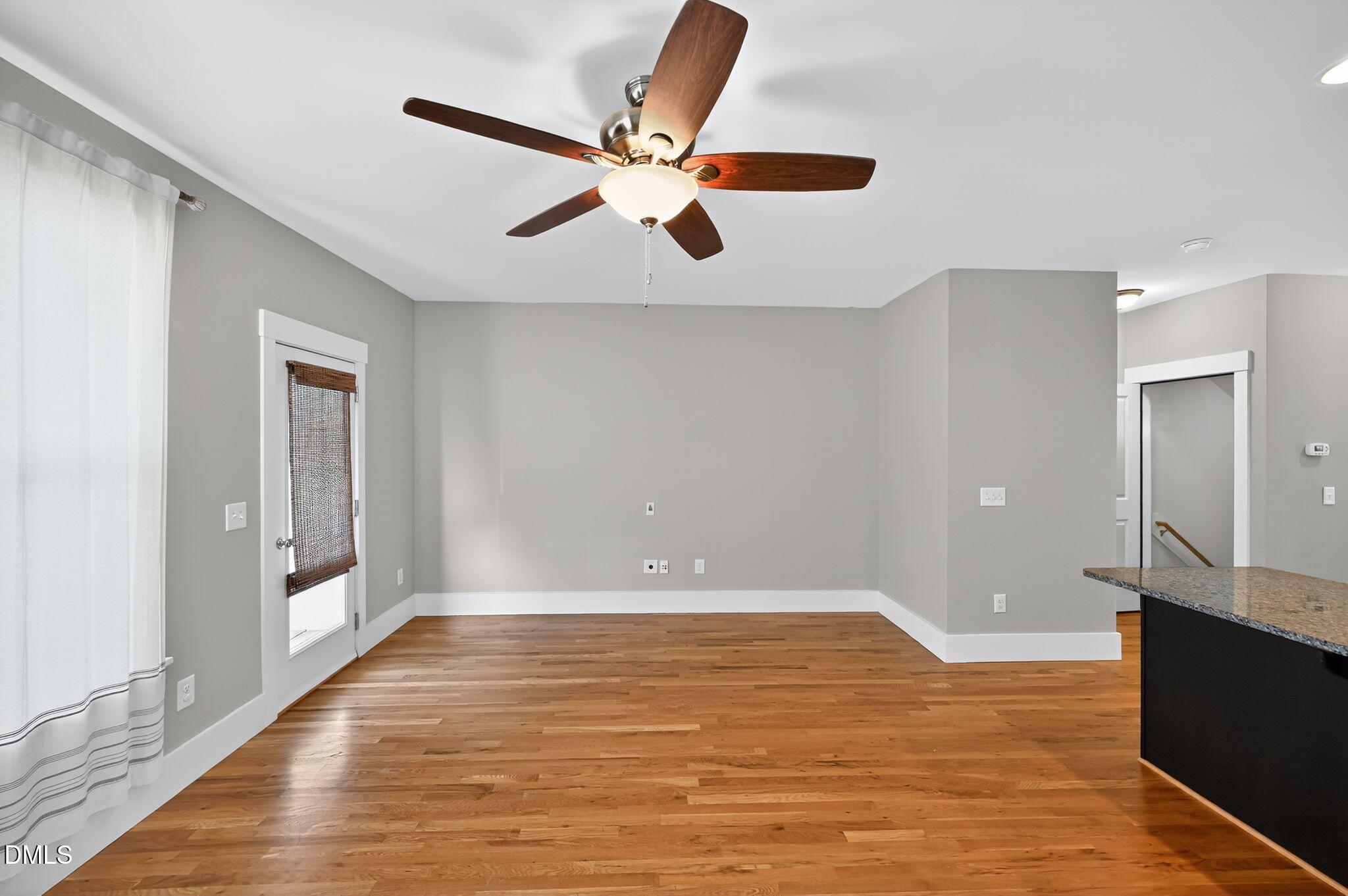 44 Owen Towne Road Chapel Hill, NC 27516 - Photo 10 of 64 a view of an empty room with window and wooden floor